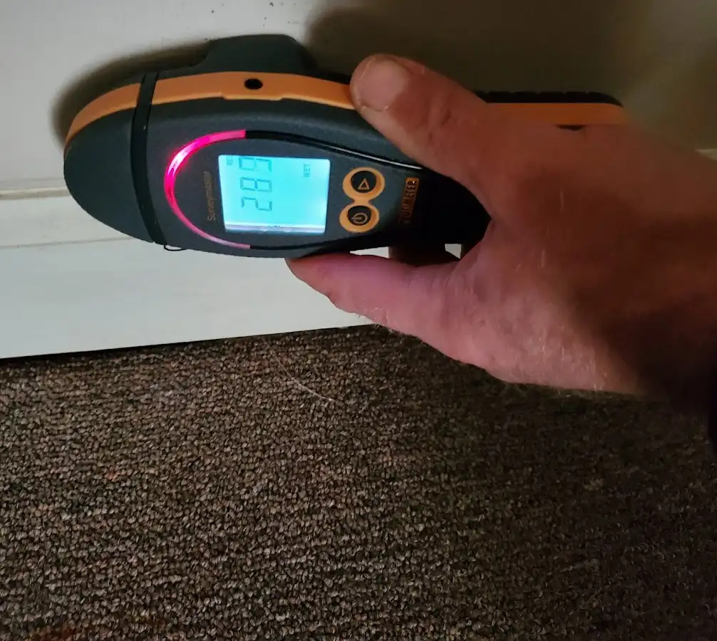 Moisture detection at baseboard during Storm Damage Restoration in Thomasville